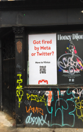 Poster on Deptford High Street - 'Got fired by Meta or Twitter? Move to Vilnius' with a QR code on the poster